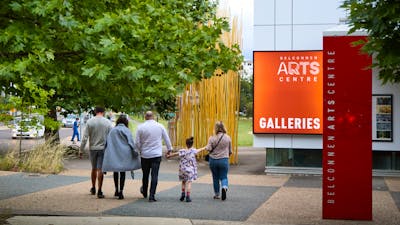 A family walk together by Belconnen Arts Centre.