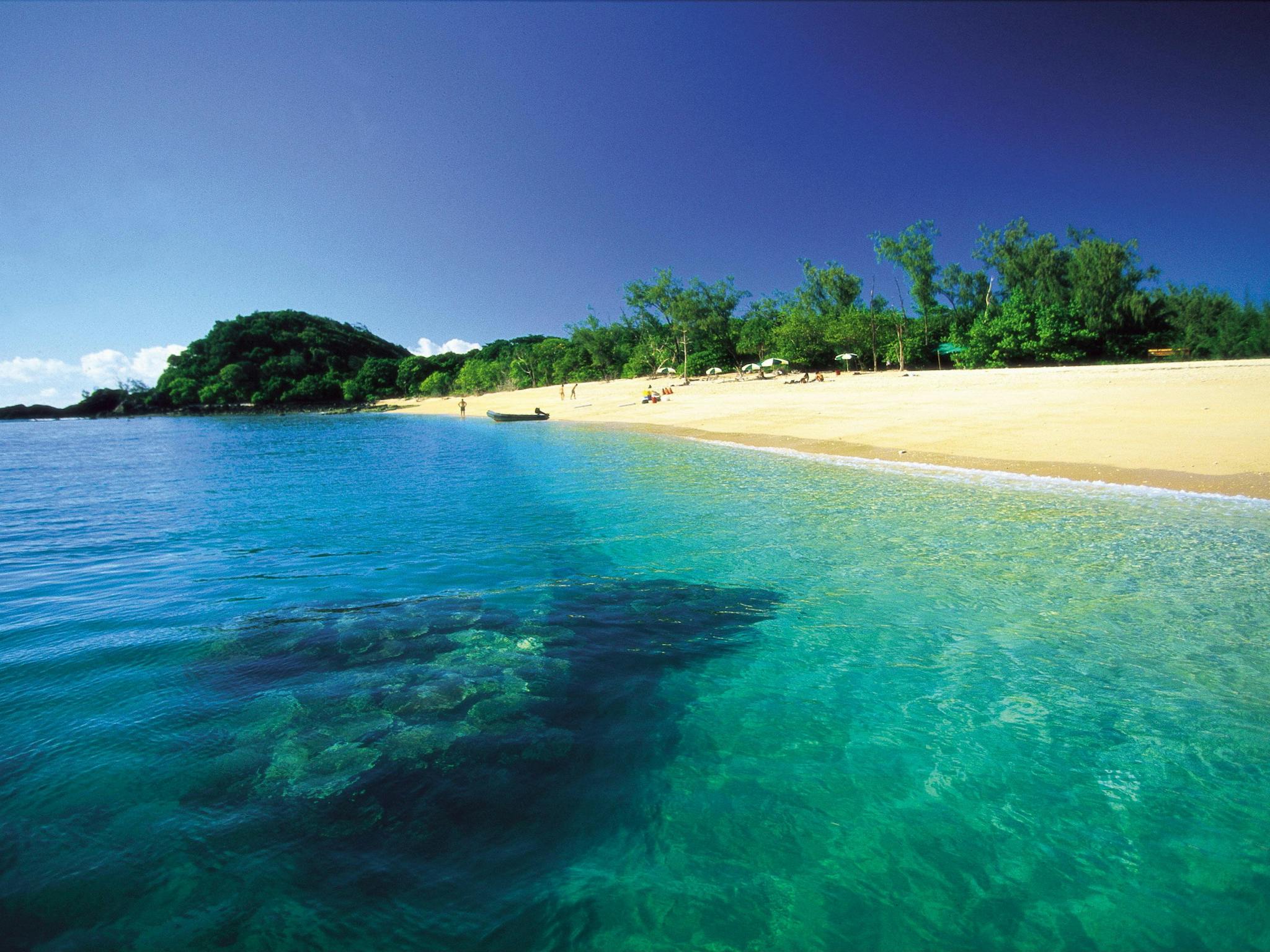 Tinny on sand on island in Frankland Group Tinny on sand on island in Frankland Group