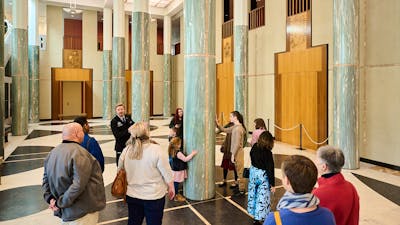 People during a tour in the Marble Foyer of Parliament House