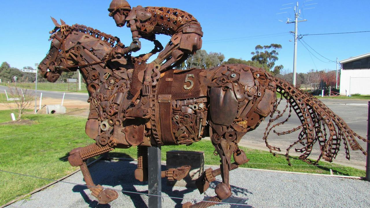 A sculpture of a jockey riding a horse in Morundah.