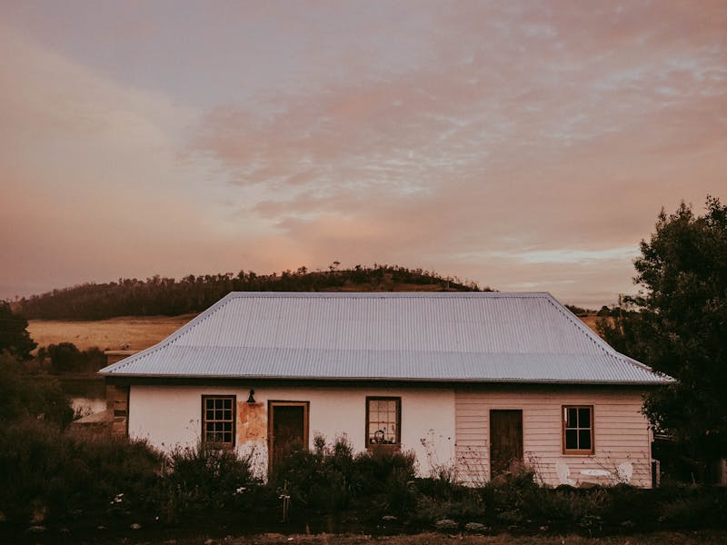 Georgian cottage pictured under a pink dusk sky