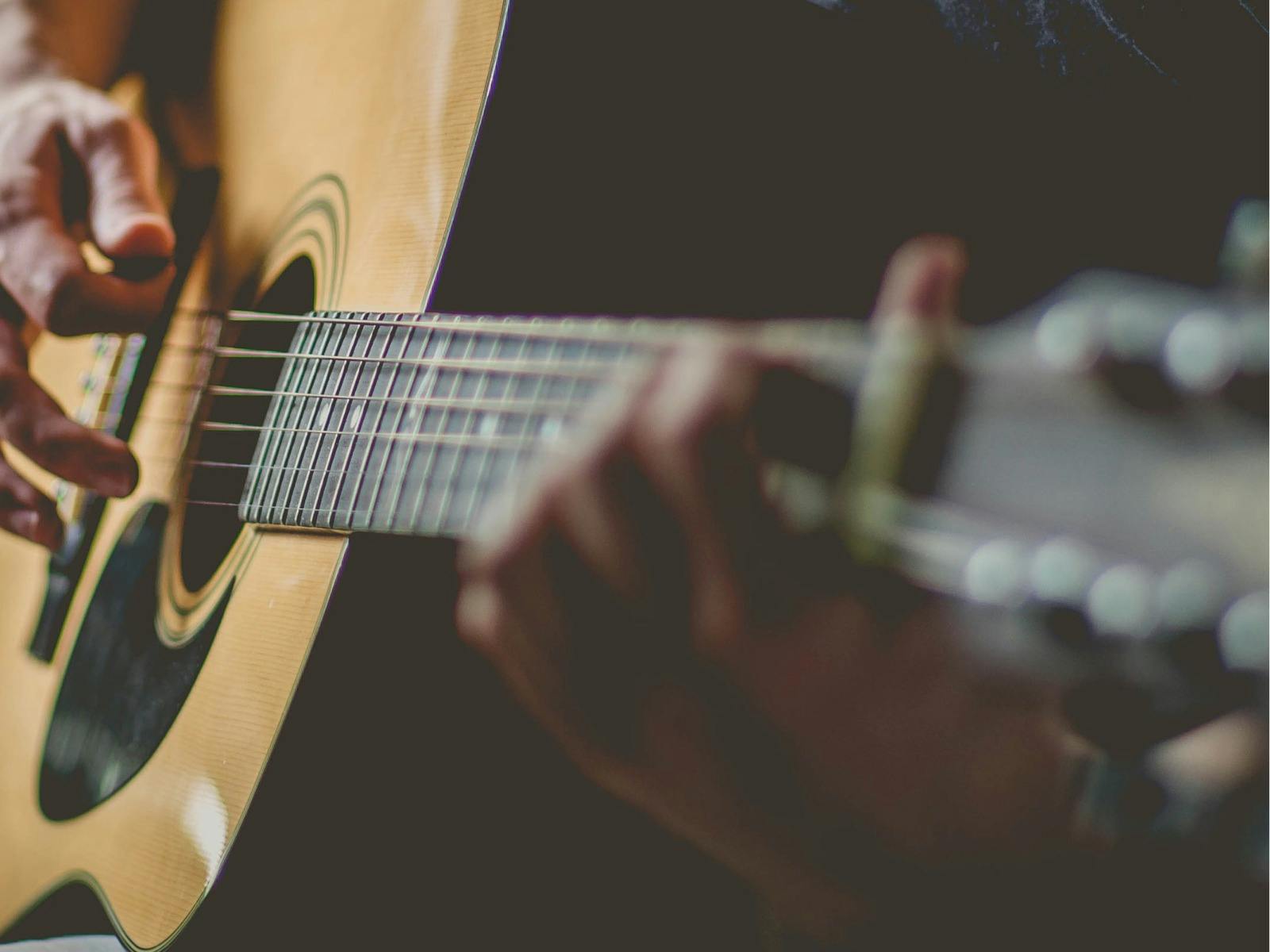 Person playing guitar