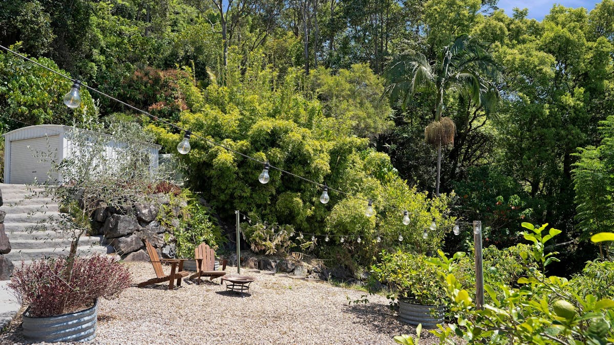 Garden with outdoor firepit, citrus trees and views