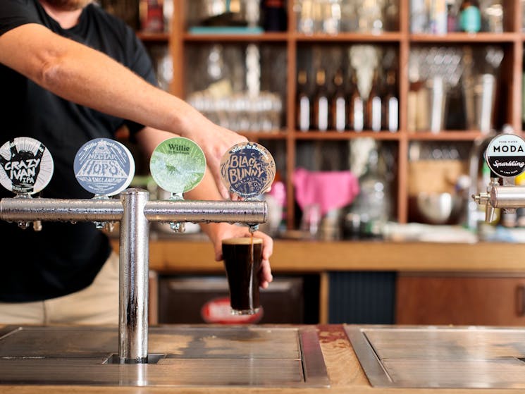 Bartender pouring beers at Willie The Boatman, St. Peters