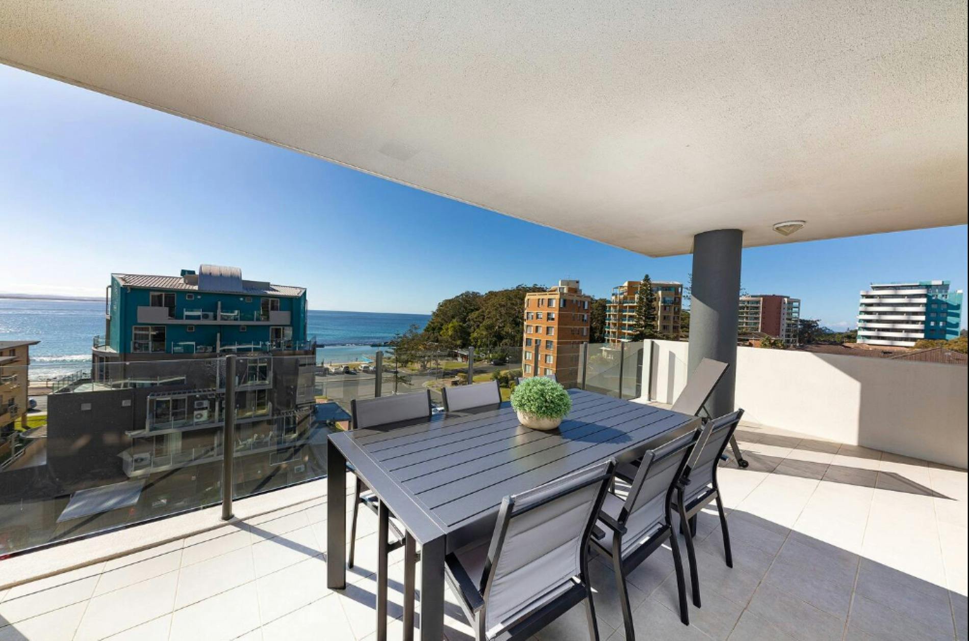 Balcony with ocean views and dining setting