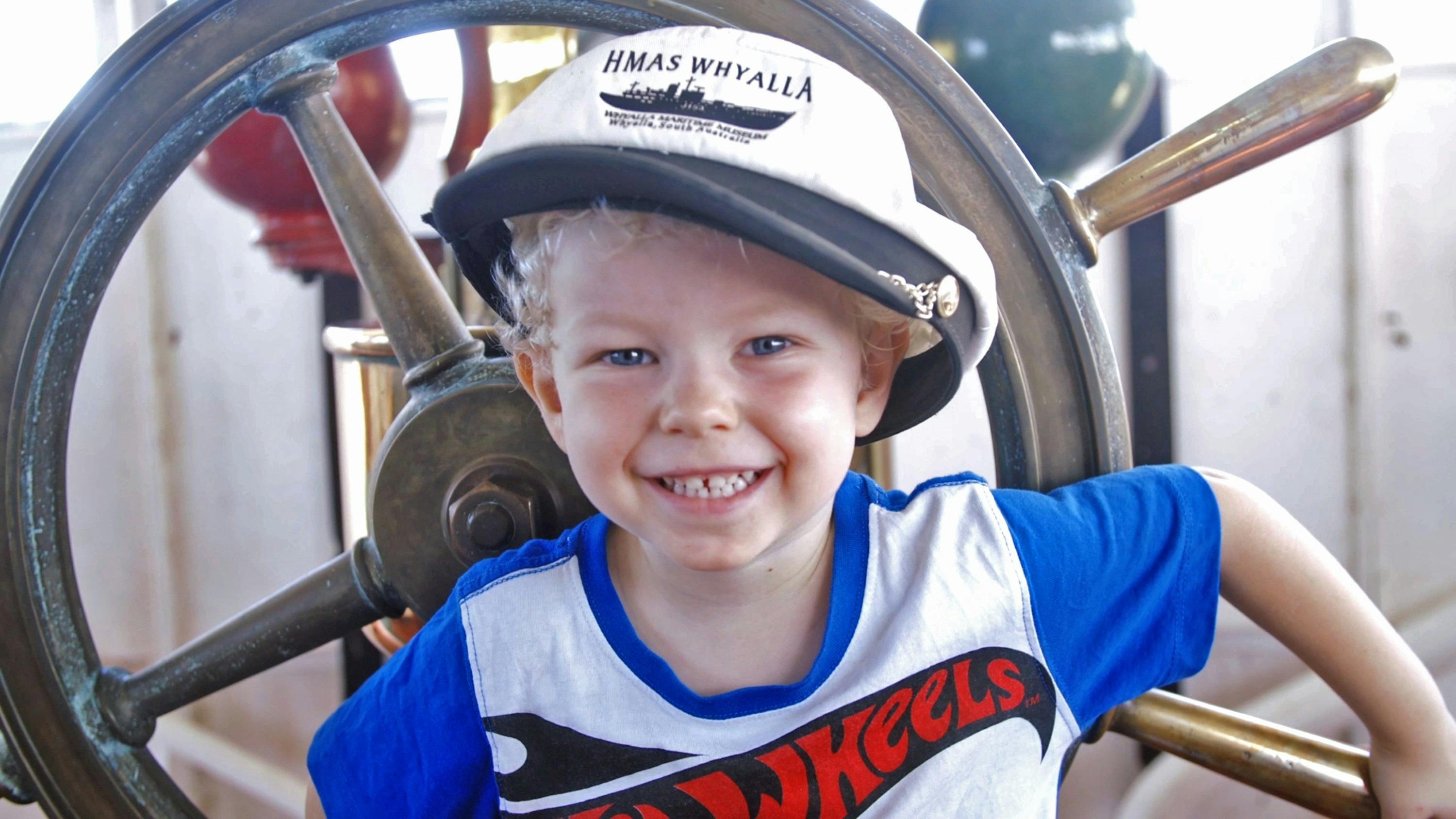 Boy & Ship's wheel