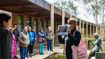 Local guide in Canberra walking with group