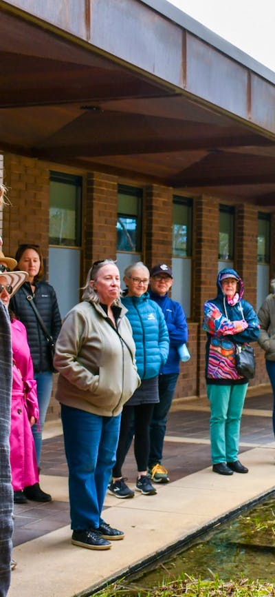 Local guide in Canberra walking with group