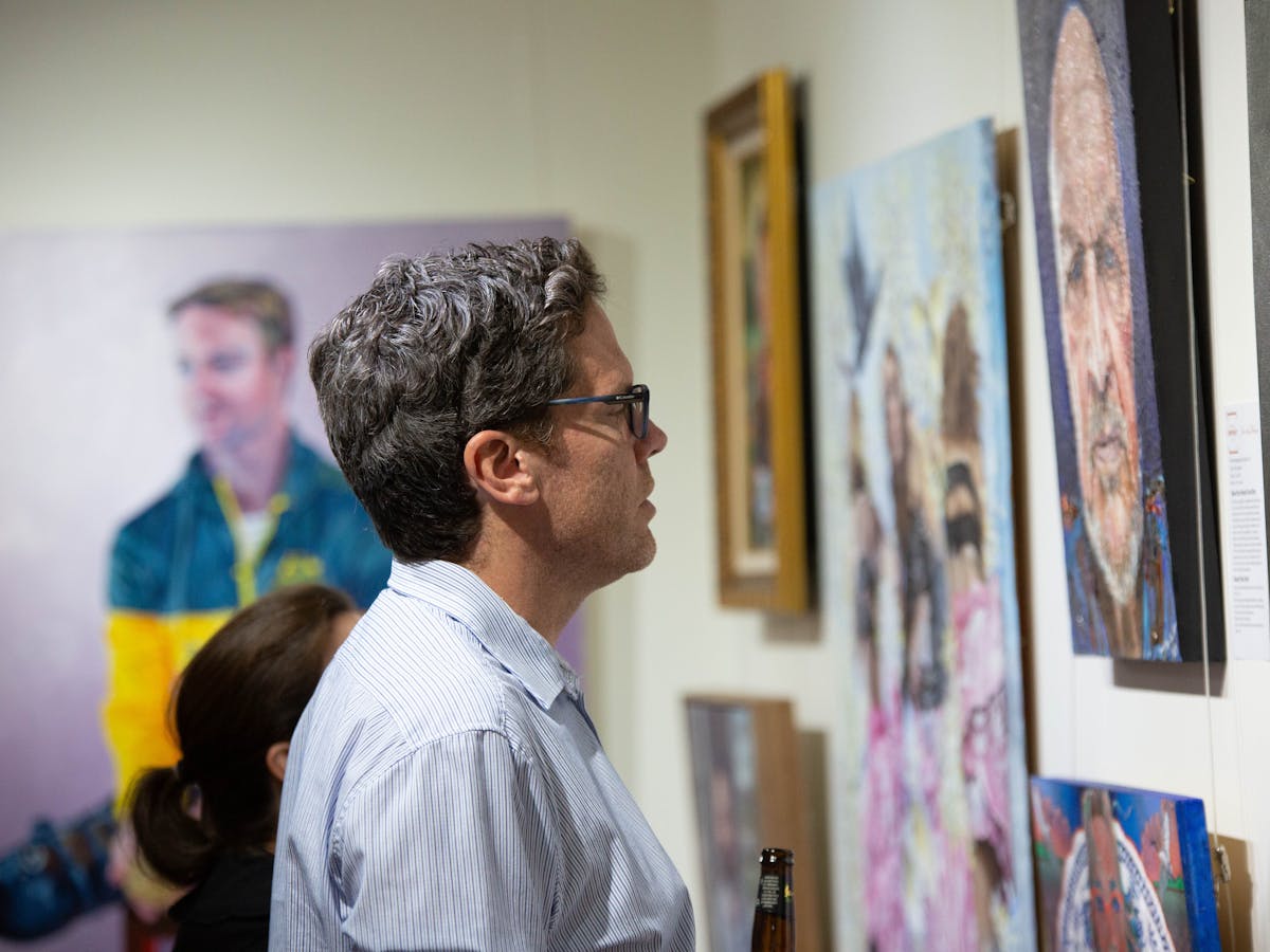 Visitor enjoying an RQAS exhibition.