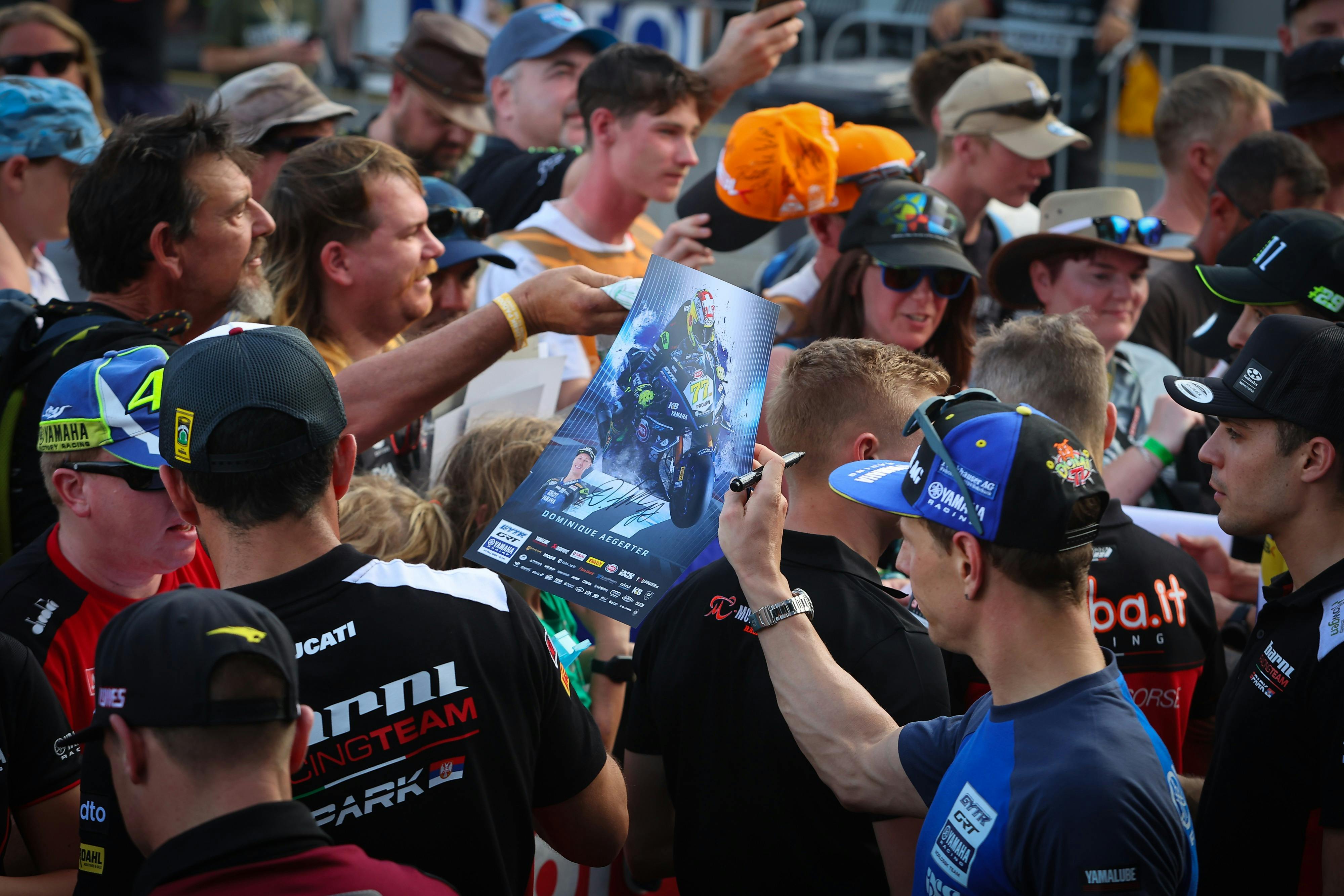 Fans enjoying the atmosphere and getting autographs from WorldSBK riders.