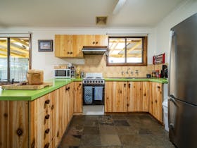 The kitchen is extremely well appointed with a multitude of utensils and modern appliances