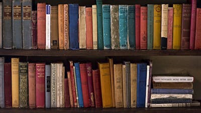 a book shelf filled with old publications