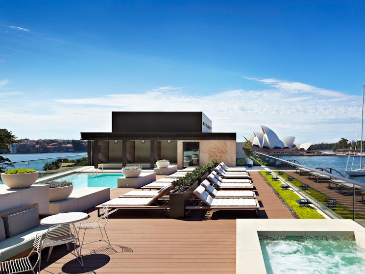 View of Sydney Opera House and harbour from rooftop pool and terrace of Park Hyatt Sydney hotel