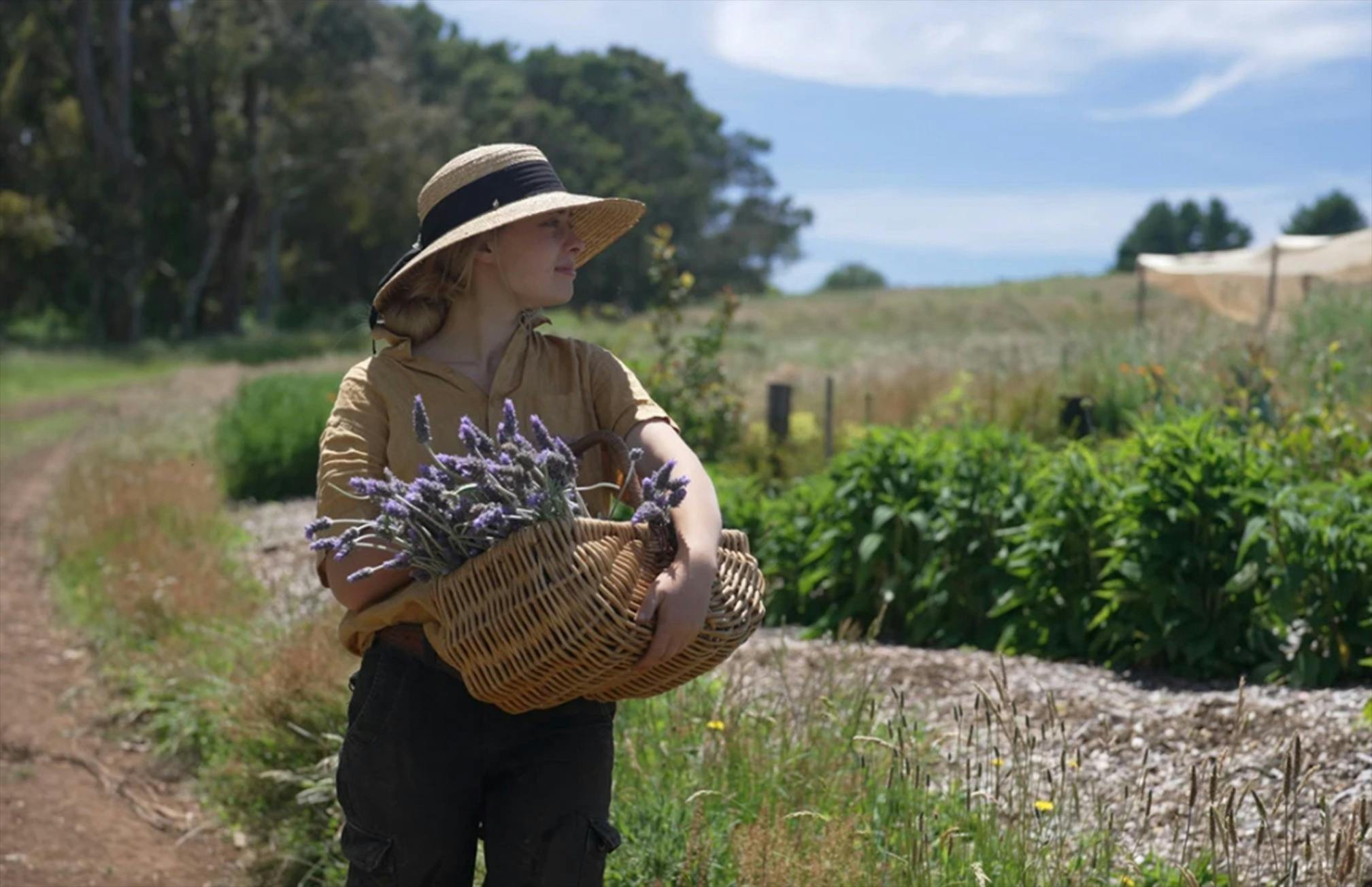 Maya Carroll-Tischler with a basket of lavender