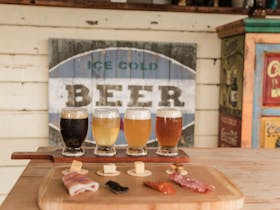 Beer tasting paddle and tasting plate on our Beer Belly Tour