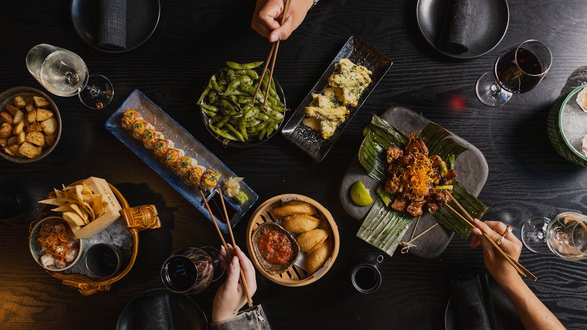 a selection of dishes, tomiri chicken, thick potatoes, aztec street corn a selection of dishes, tomiri chicken, thick potatoes, aztec street corn