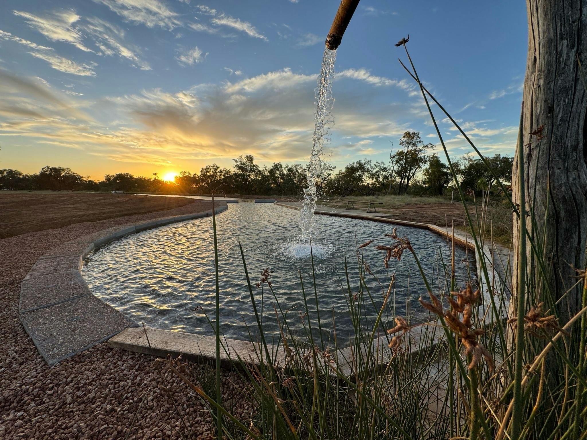 Water flowing from the natural bore head into the hot springs, Charlotte Plains, Outback Queensland