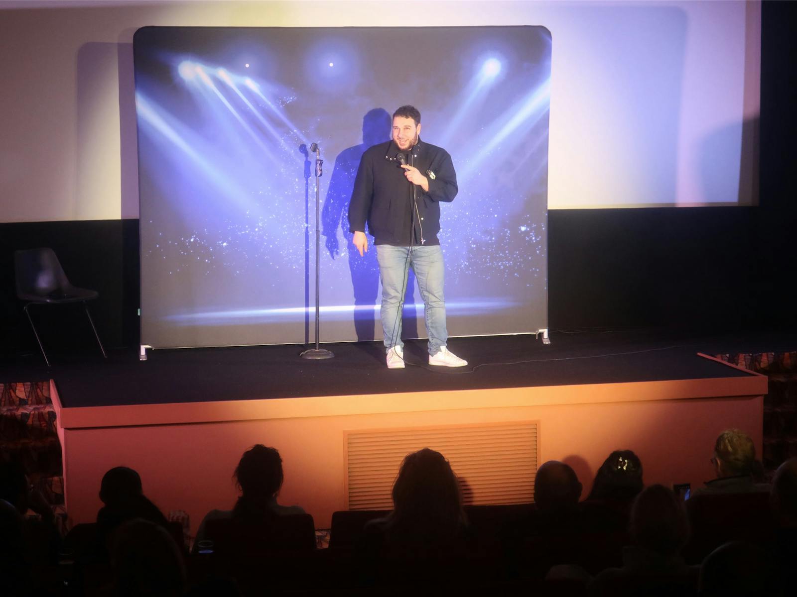 Comedian Jamal Abdul performing on stage at Roseville Cinemas