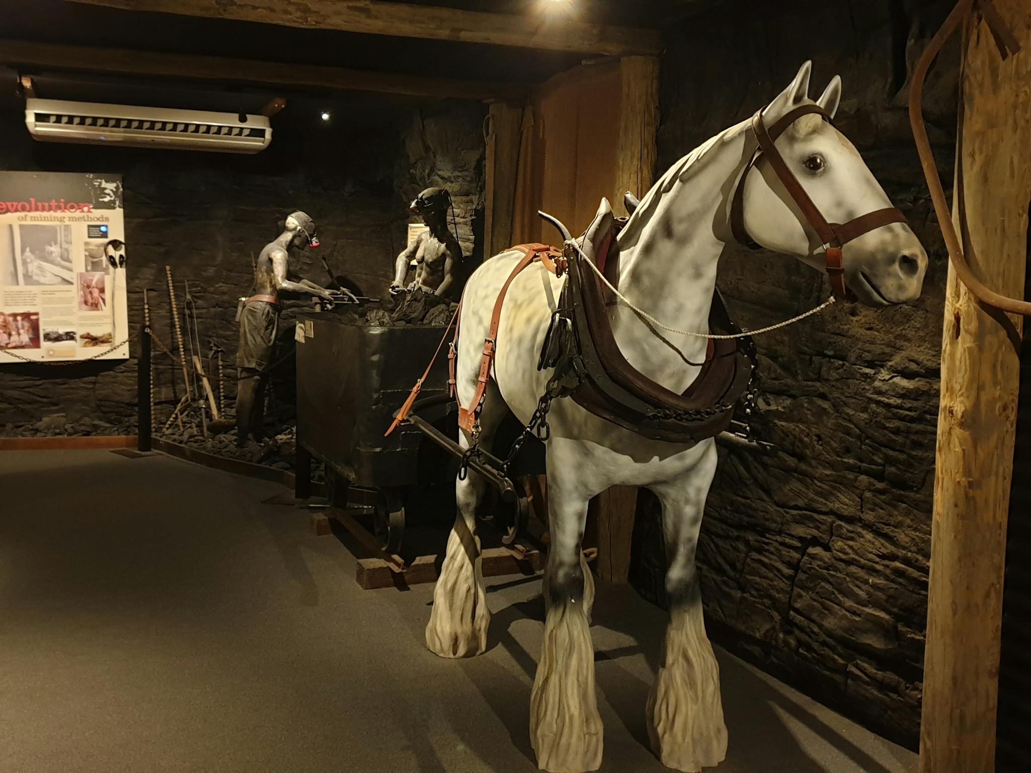 Statue of horse and two miners loading coal into carriage Statue of horse and two miners loading coal into carriage