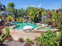 Heated pool in tropical gardens