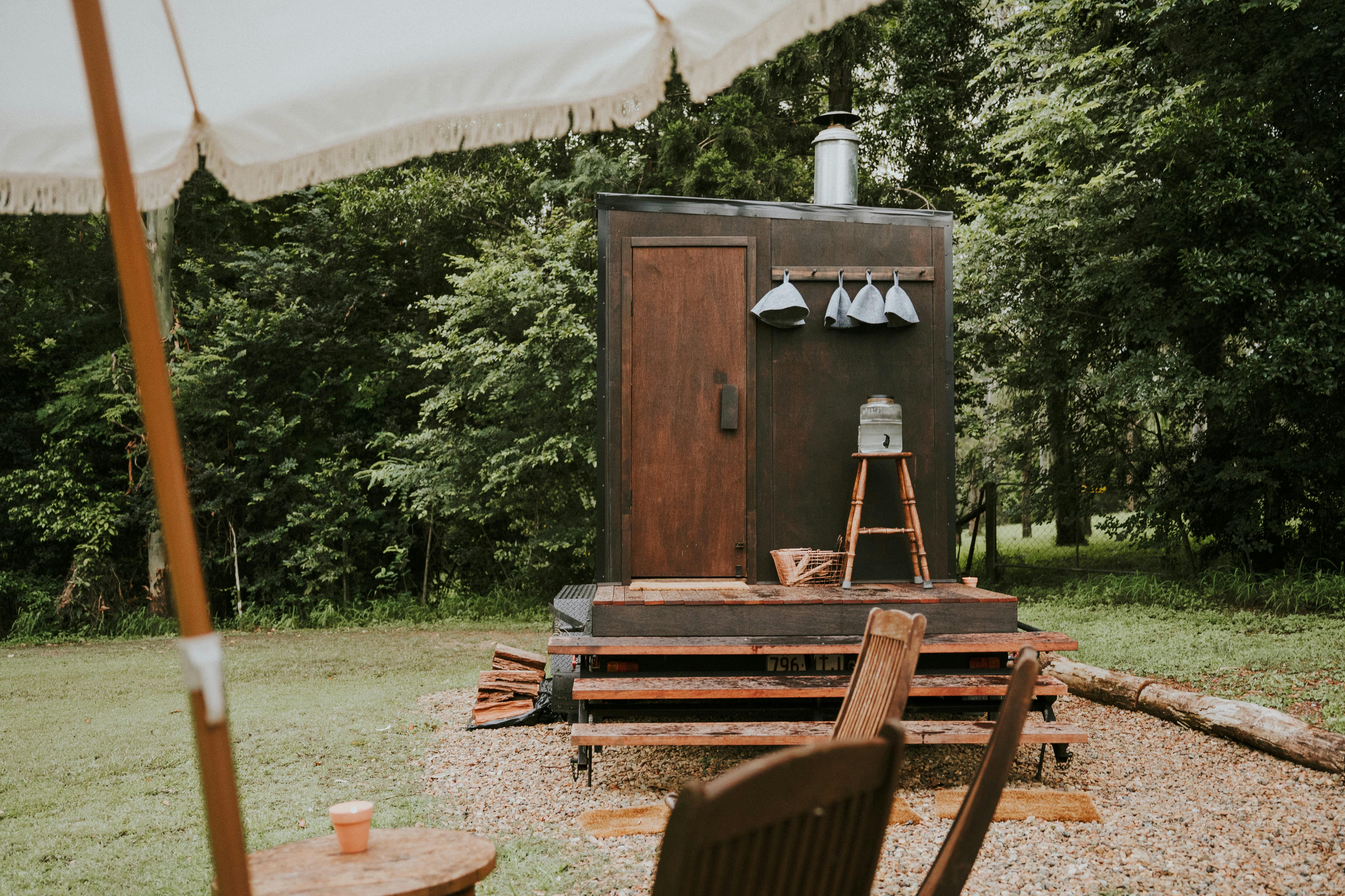 Mobile wood-fired Finnish sauna by Sauna Cult Brisbane, crafted from cedar with a panoramic window
