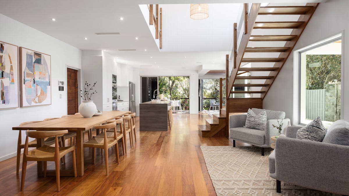 Spanning two levels with six bedrooms, three bathrooms, and multiple living areas.