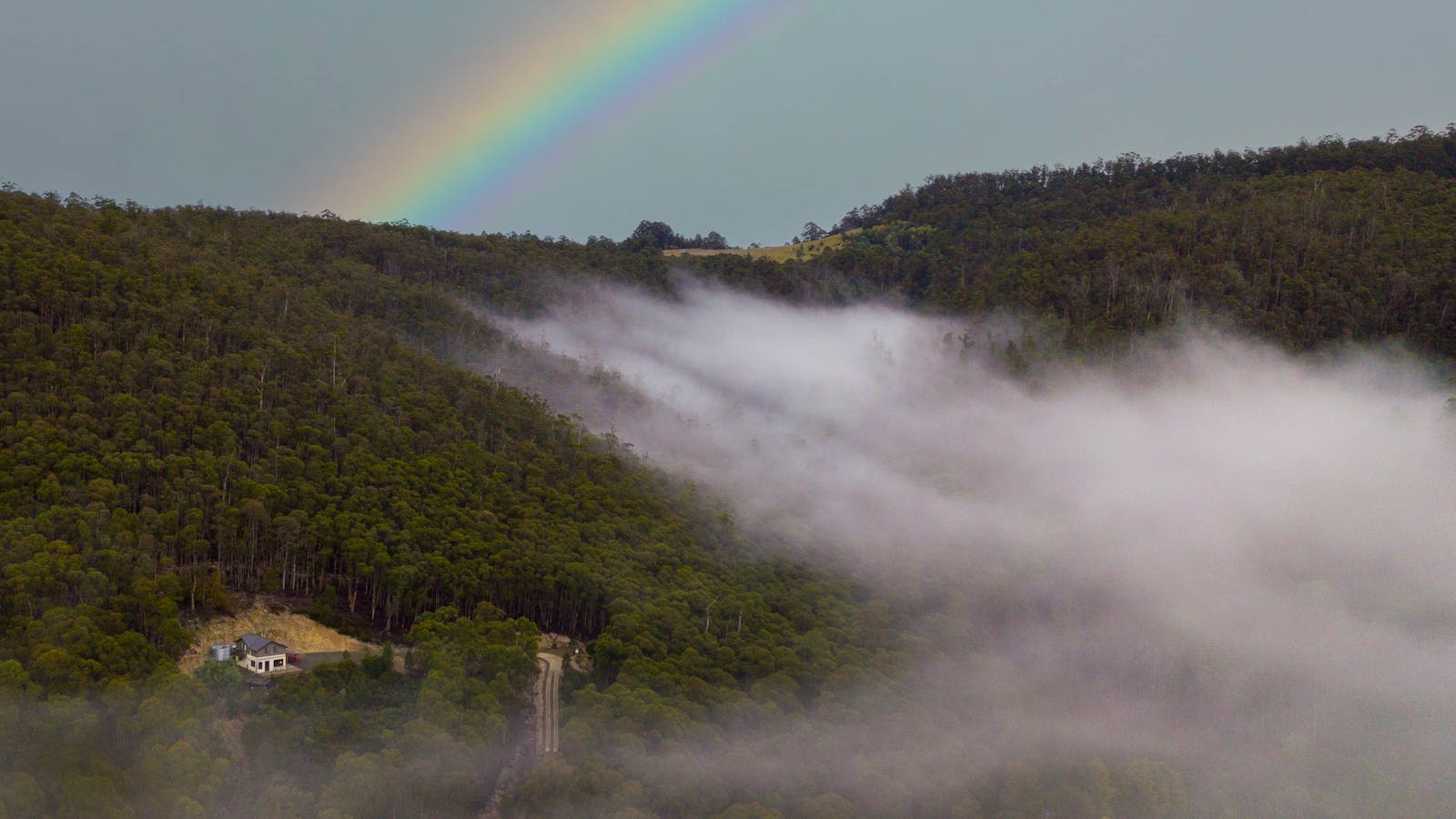 Rainbows and dreamy mists enveloping Orchards Nest hidden on the hillside
