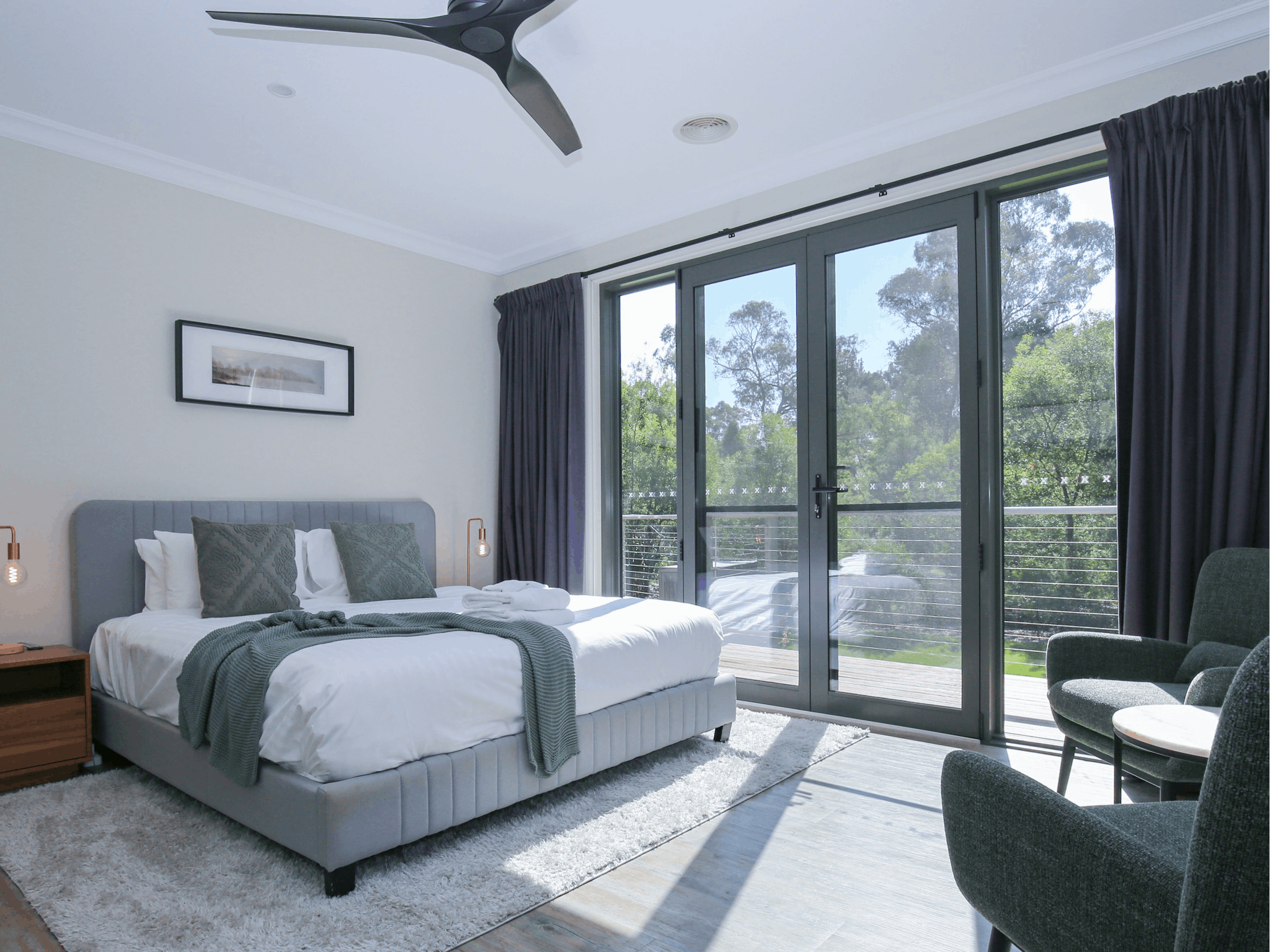 Northern Exposure Bright bedroom featuring large windows