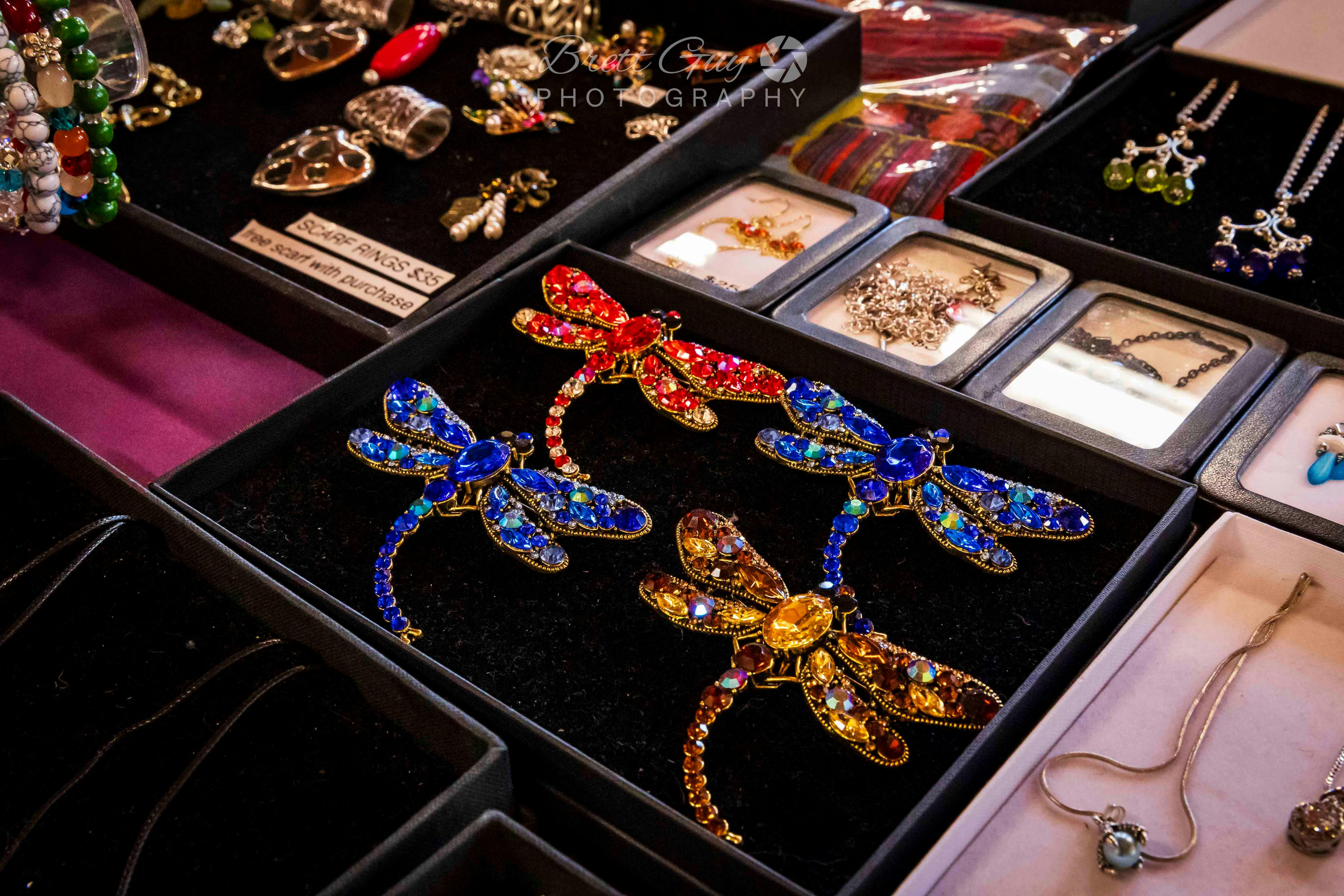jewelled dragon brooches in a black display box