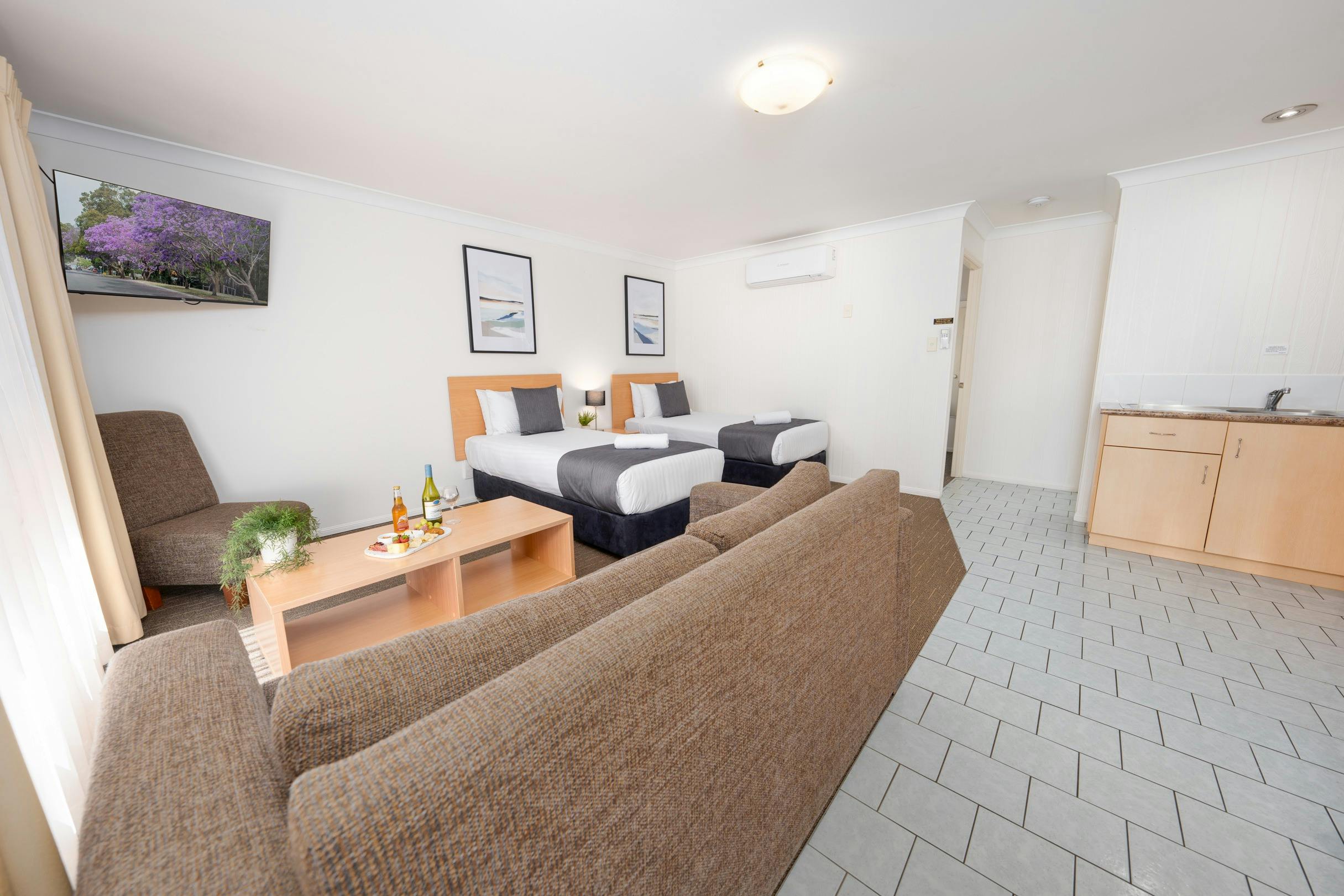 Open living with lounge area and 2 Single Beds