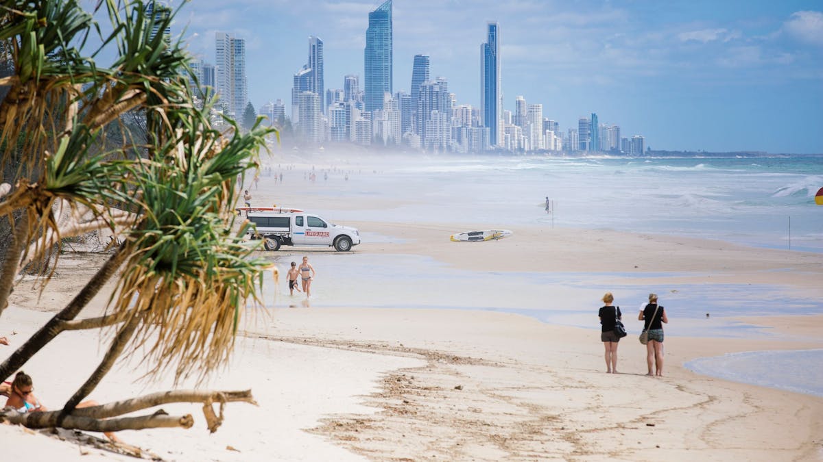People walking along Nobby Beach