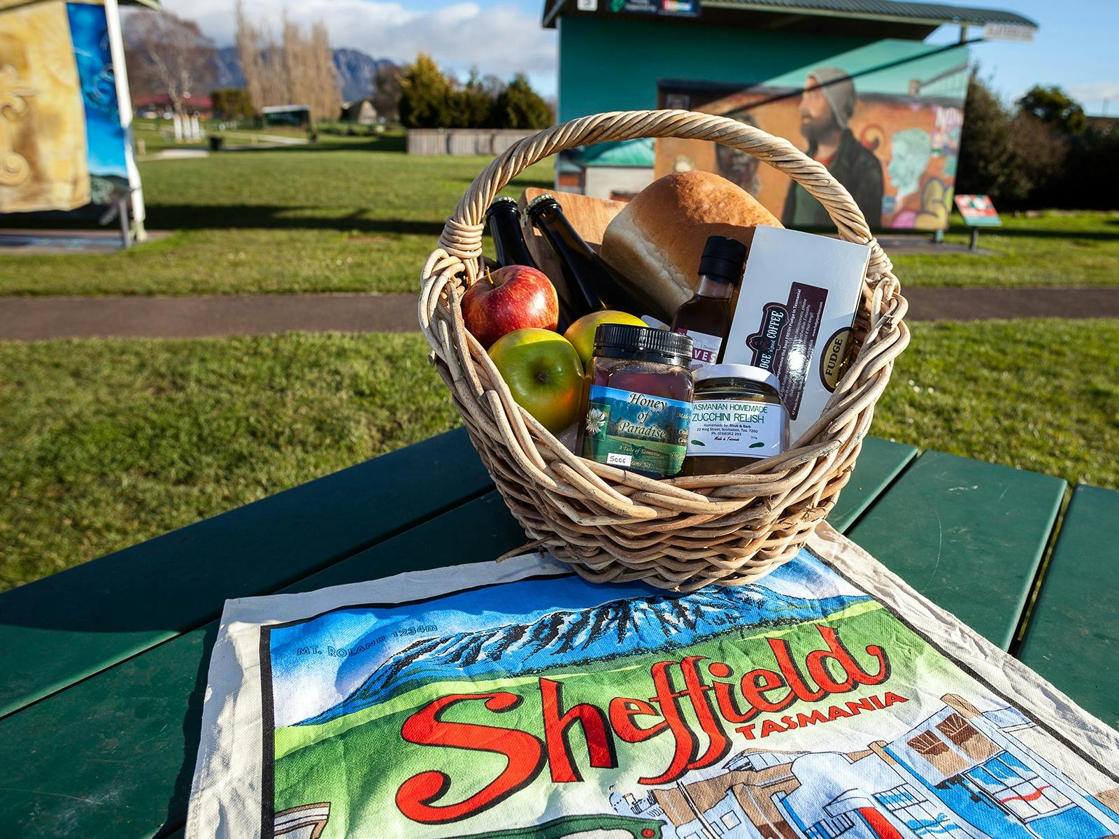 A picnic basket on table filled with local specialities