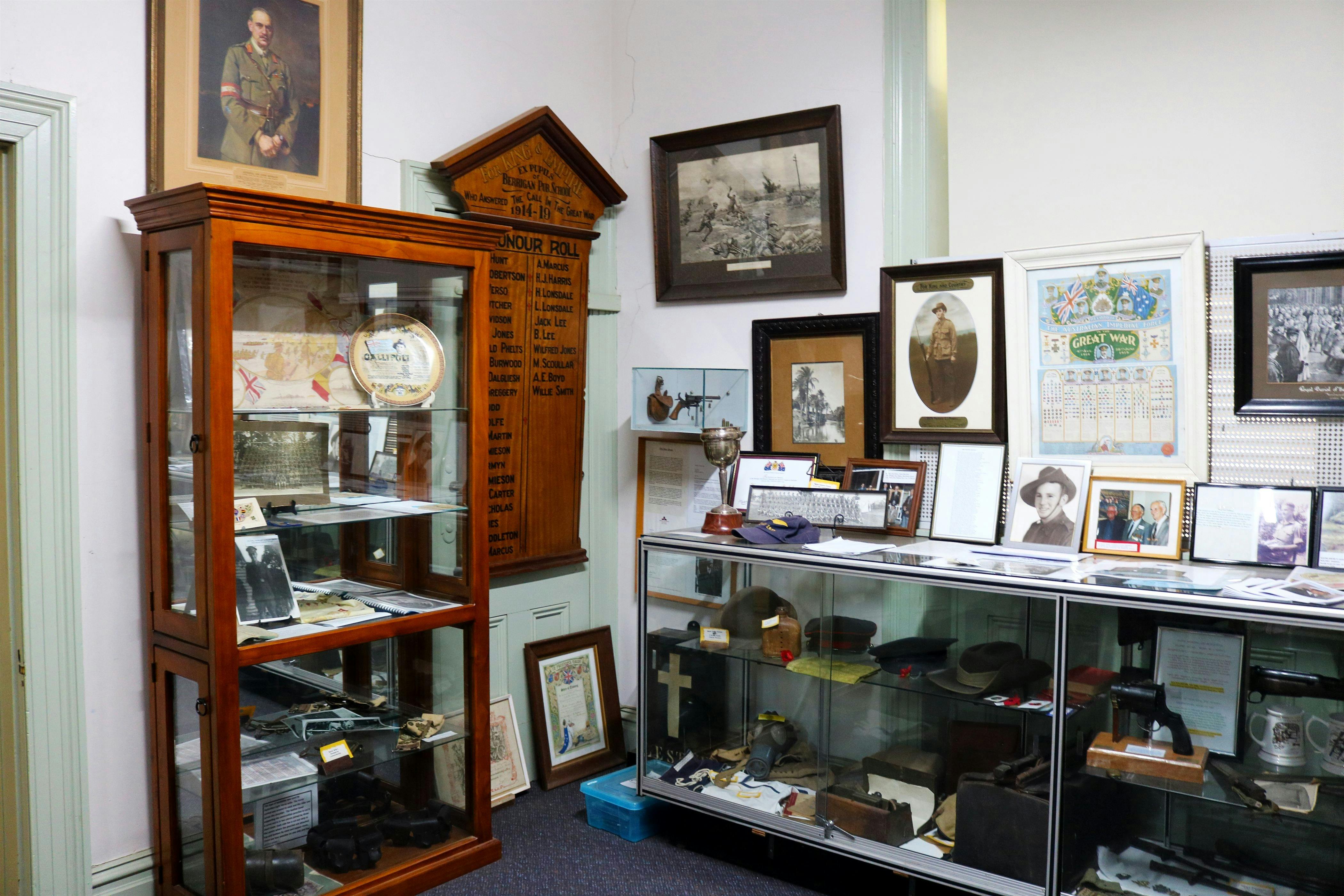 Museum interior of display cabinets holding war memorabilia