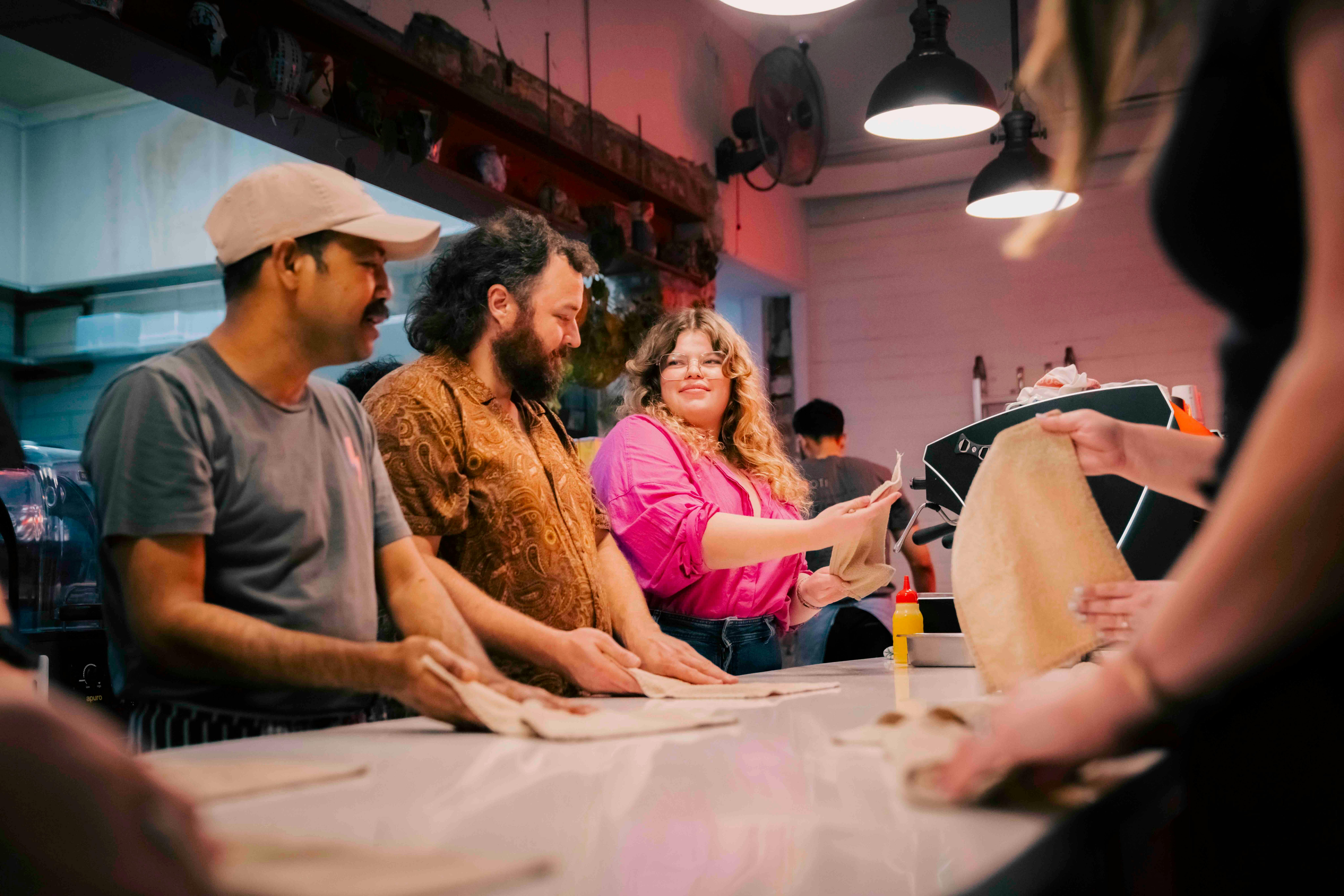 Guests learning the art of roti stretching
