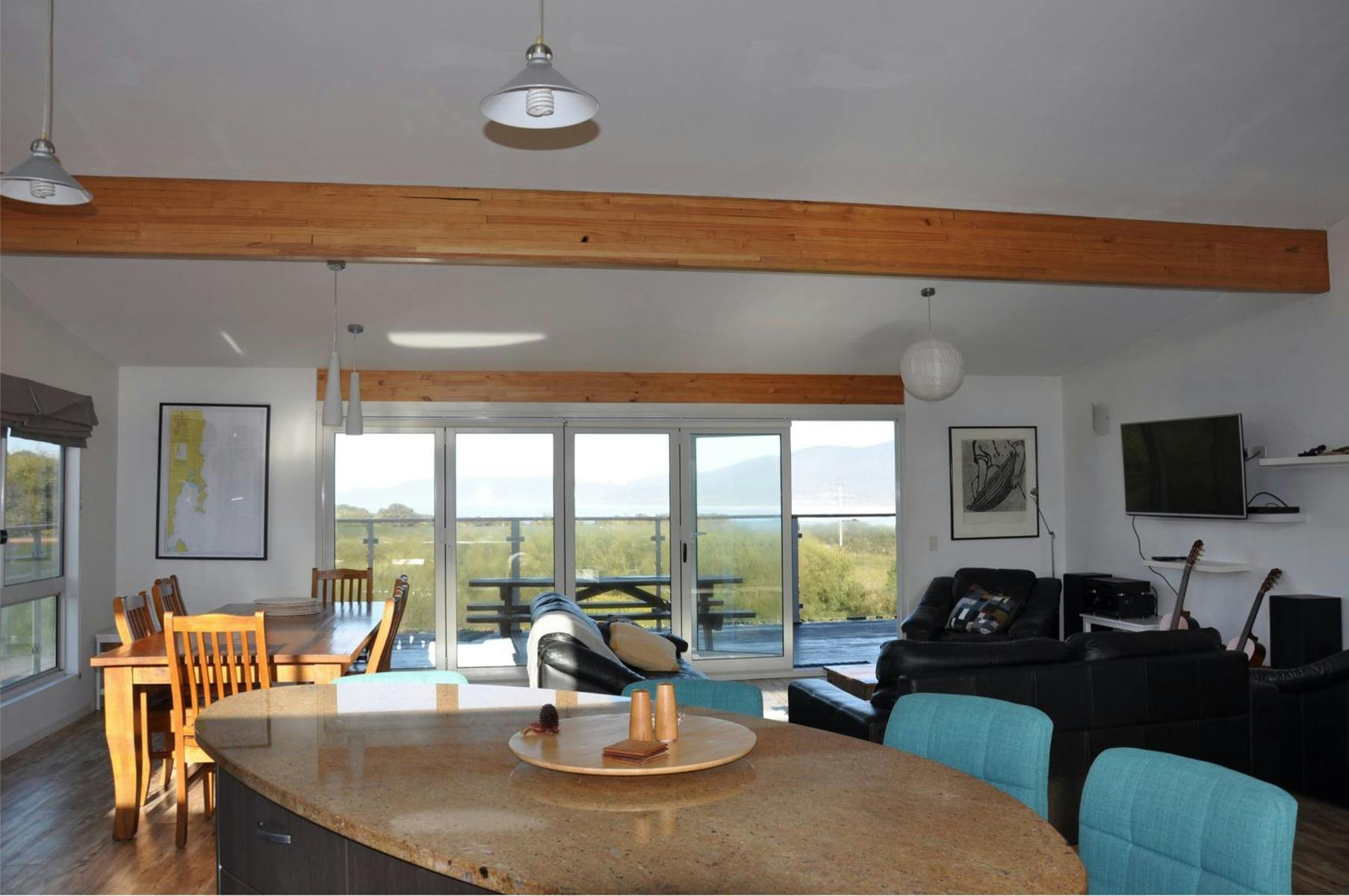 Large living space with generously appointed kitchen and views to Maclean Beach