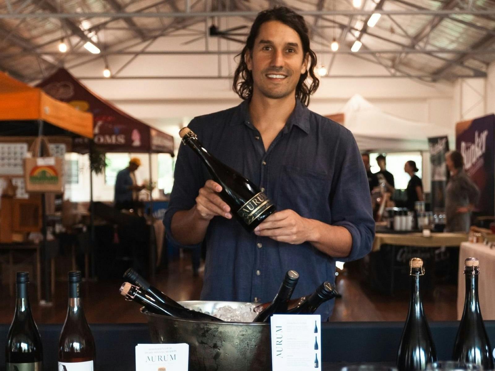 Aurum Mead creator holding wines at hall pop up