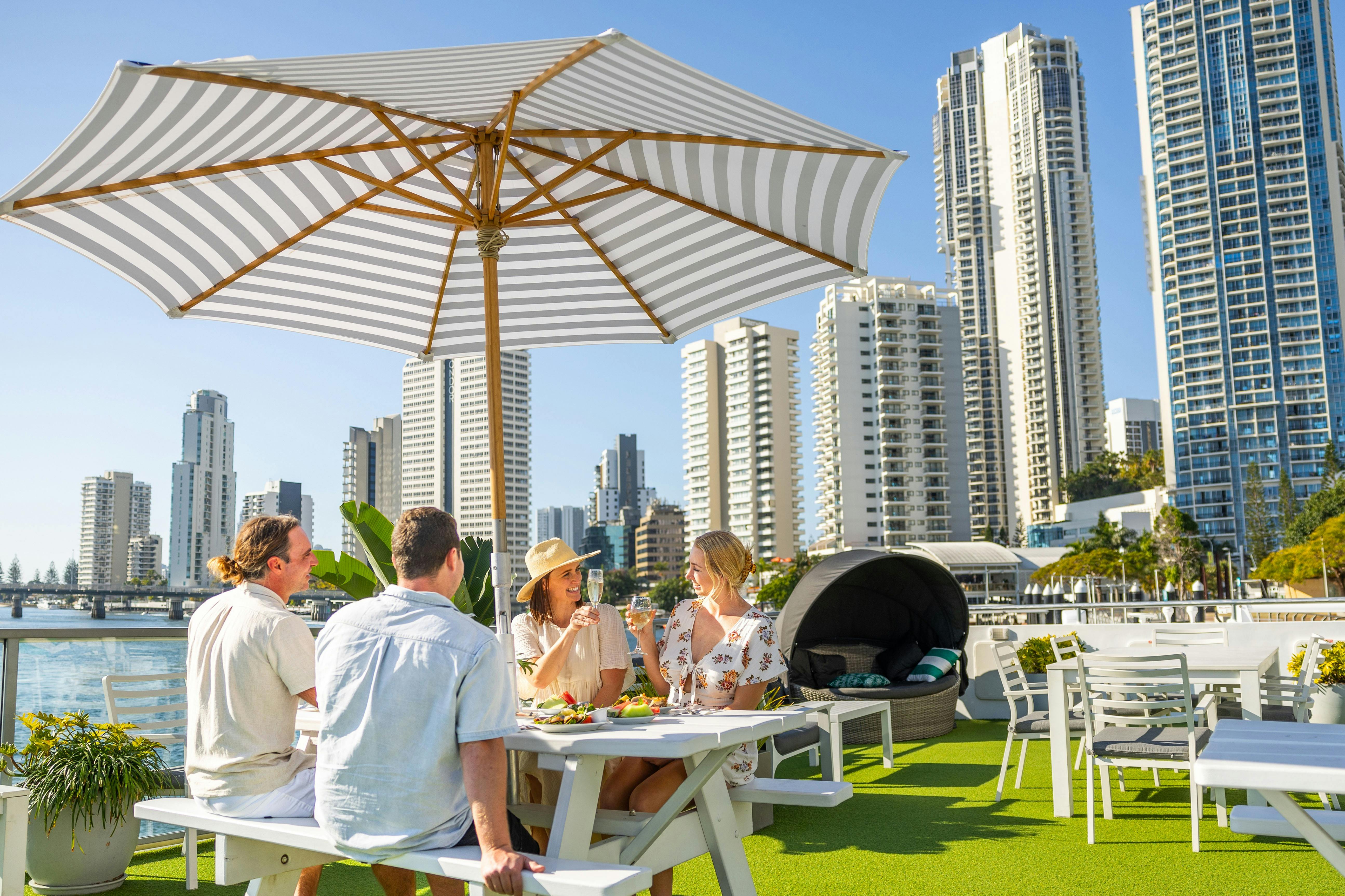 Group of friends enjoying lunch on a cruise