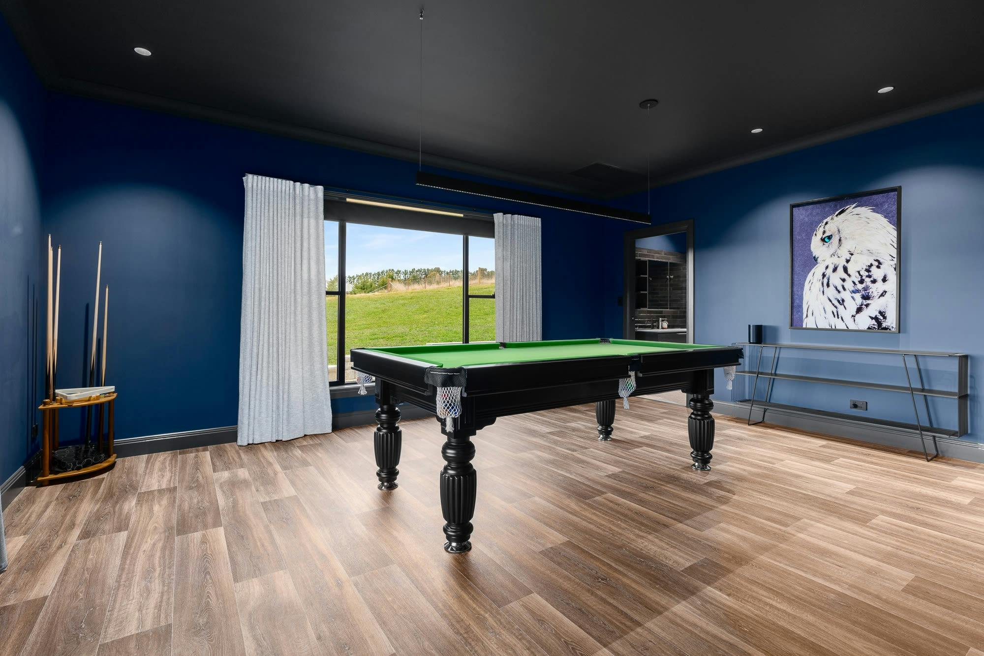 Pool table, large window with surrounding views