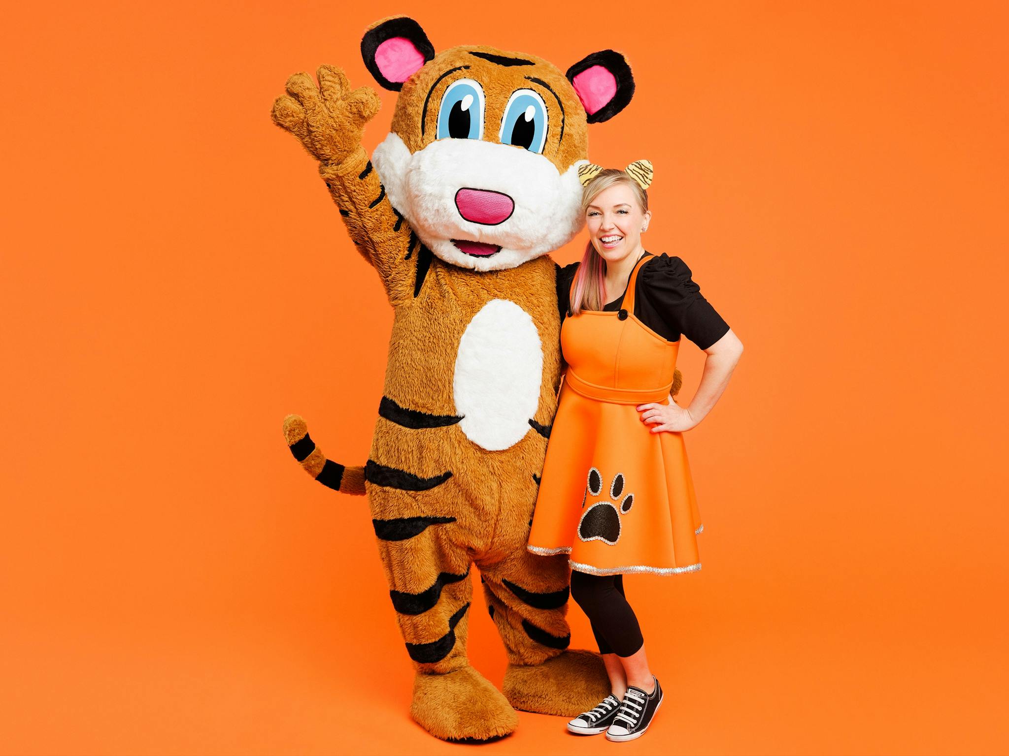 A photo of Pevan & Sarah on an orange background A photo of Pevan & Sarah on an orange background