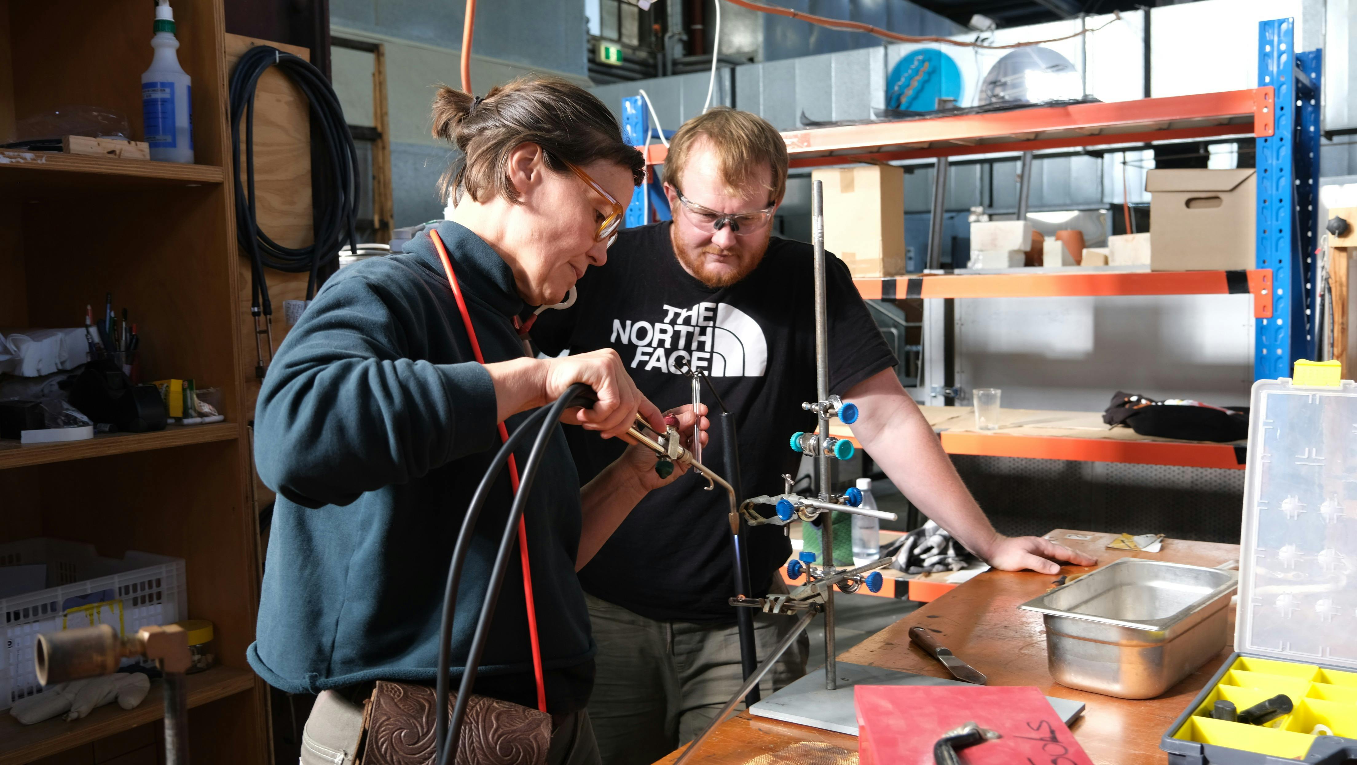 Artist bending NEON glass