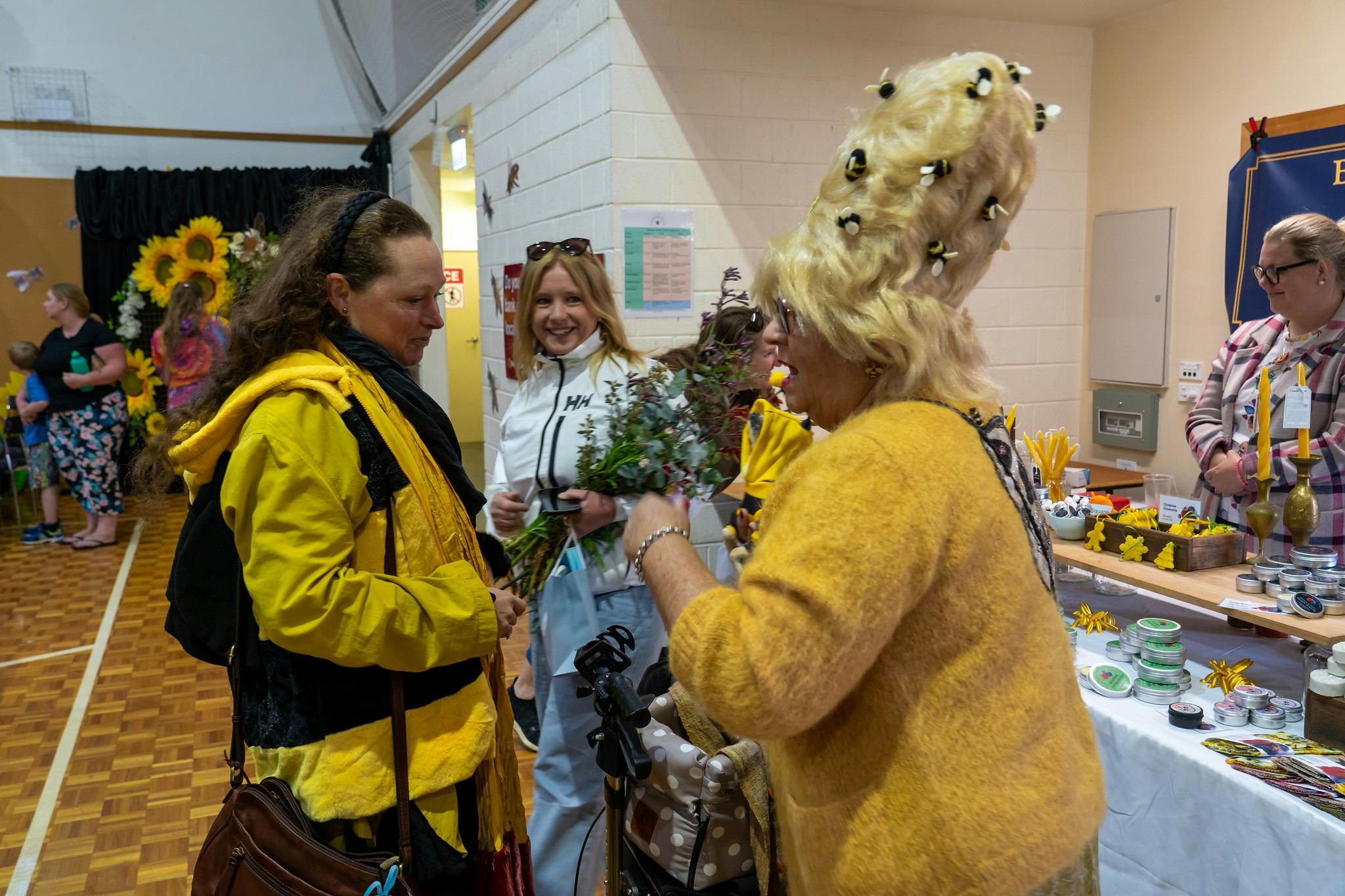 Lady with Beehive hairdo and bees on her wig