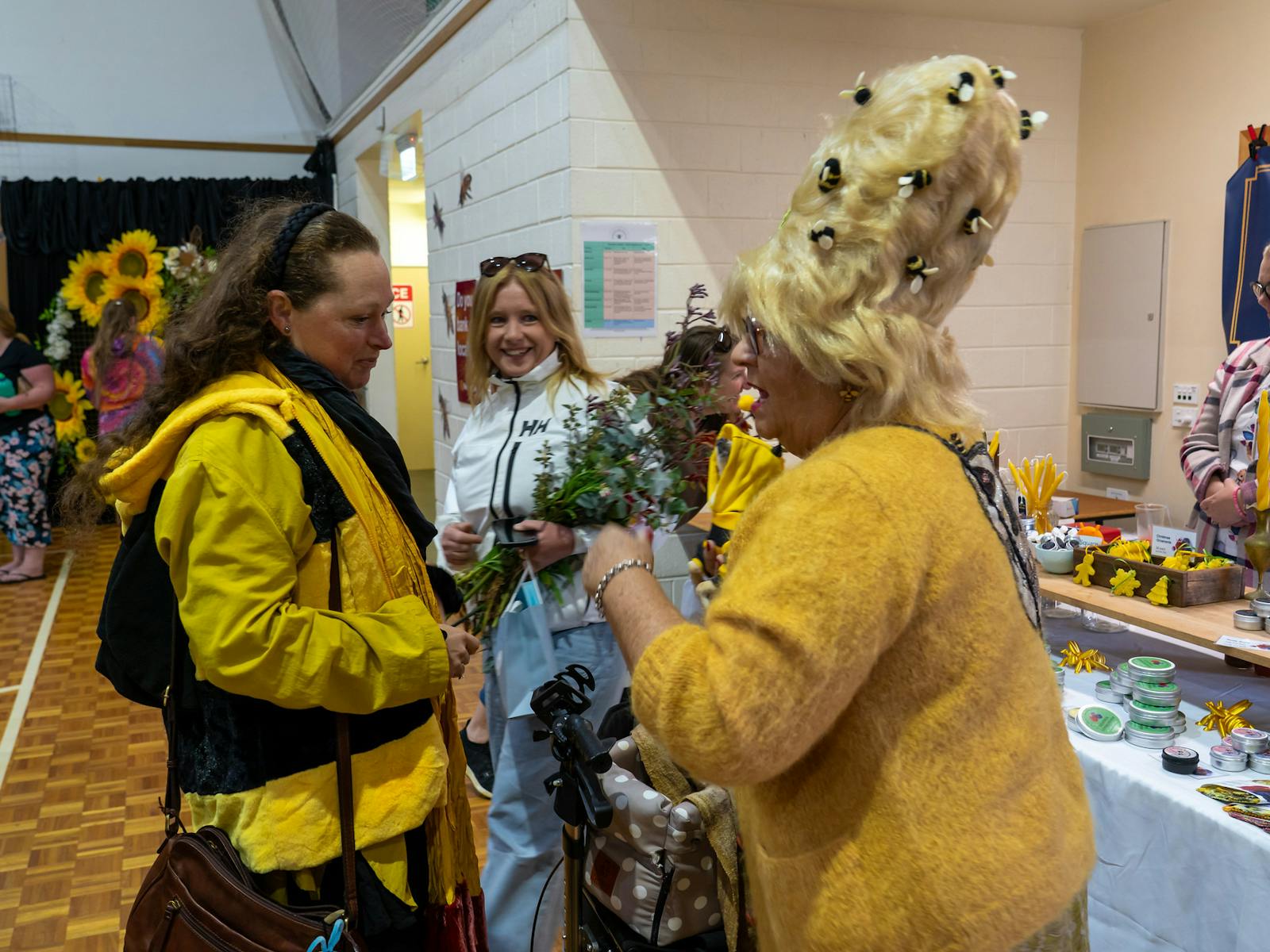 Lady with Beehive hairdo and bees on her wig