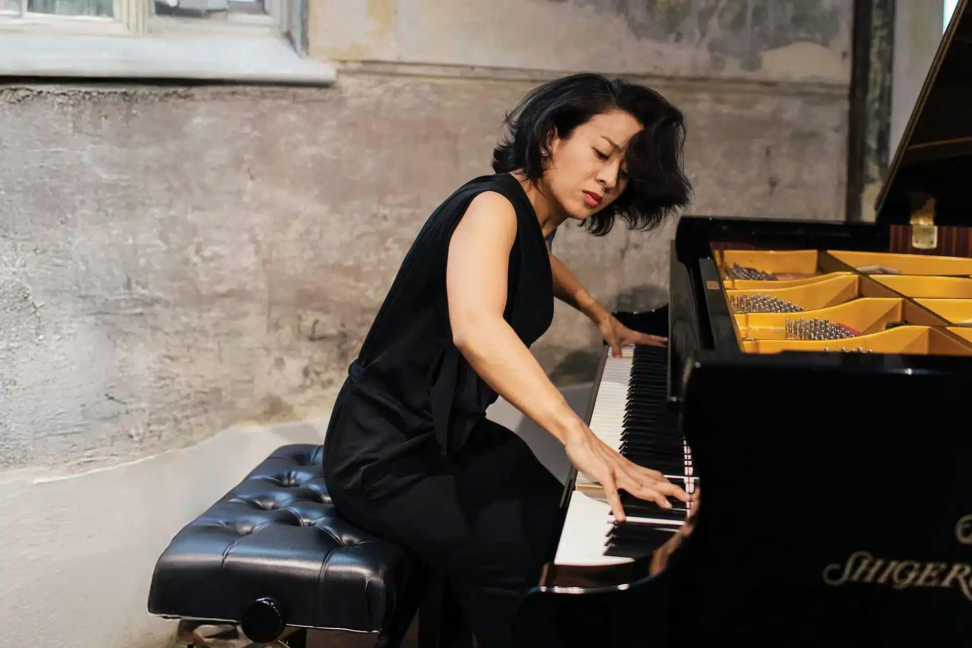 Pianist playing instrument in motion/passionately