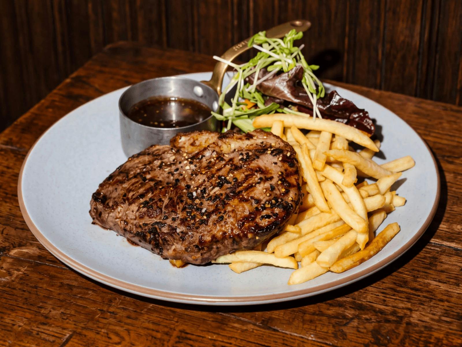 Steak and chips with gravy.
