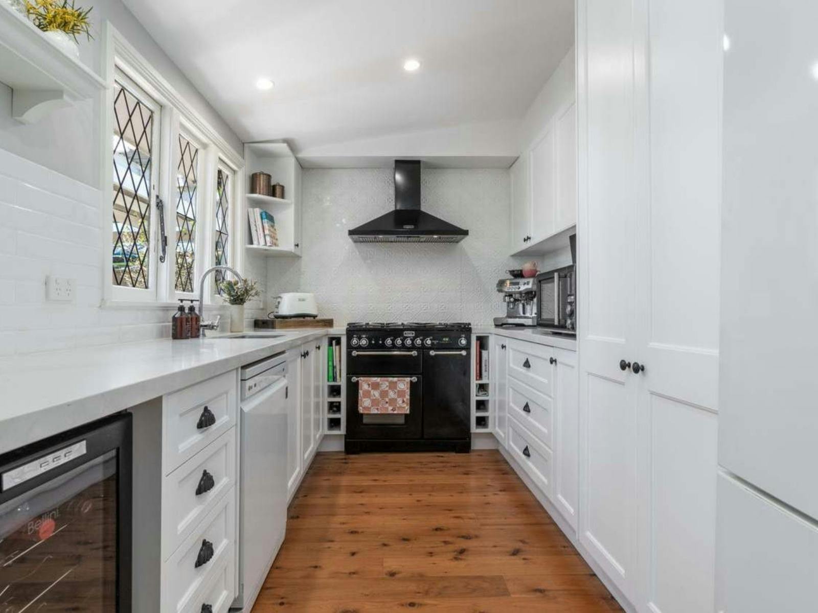 Large Clean kitchen with appliances and amenities. Perfect for cooking meals at home.