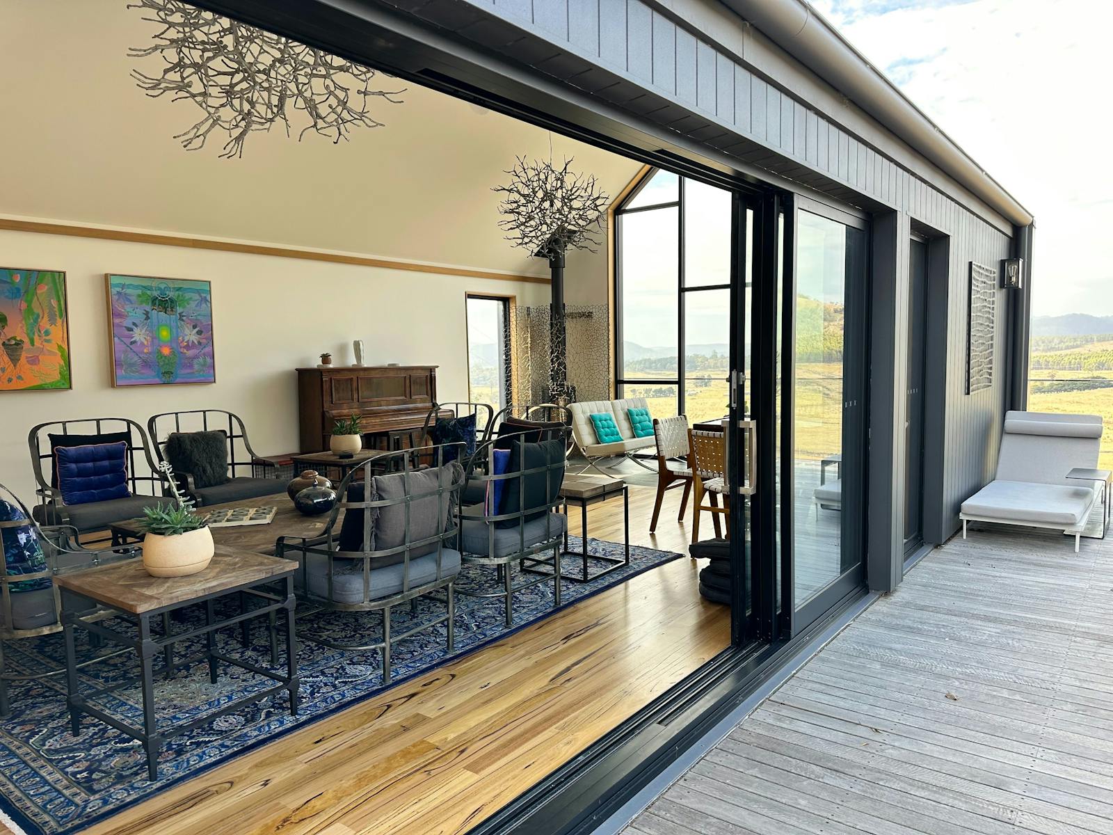 A beautiful lounge to gather, with ceiling to floor glass, facing the view.