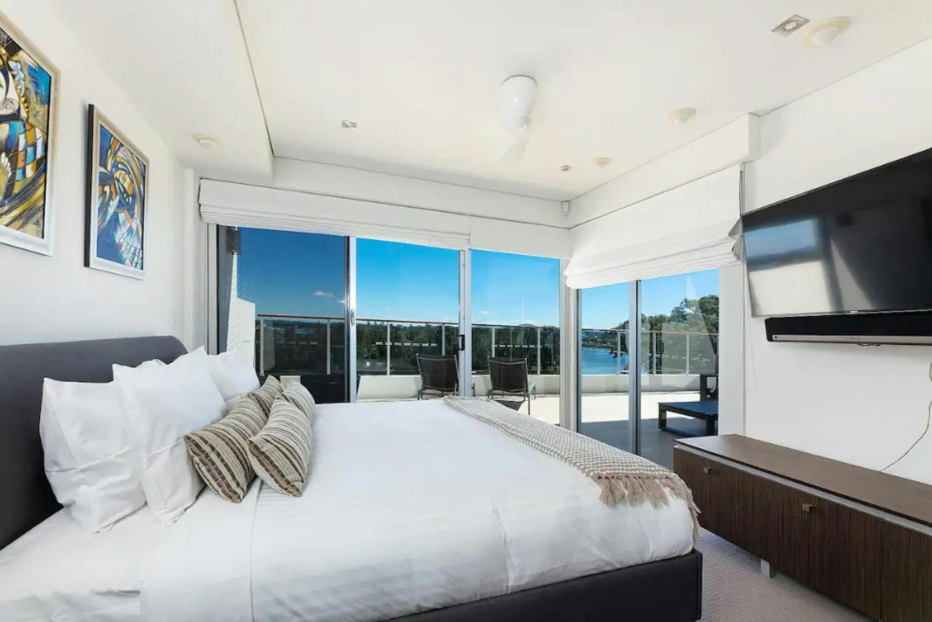 Master bedroom with TV and lake views