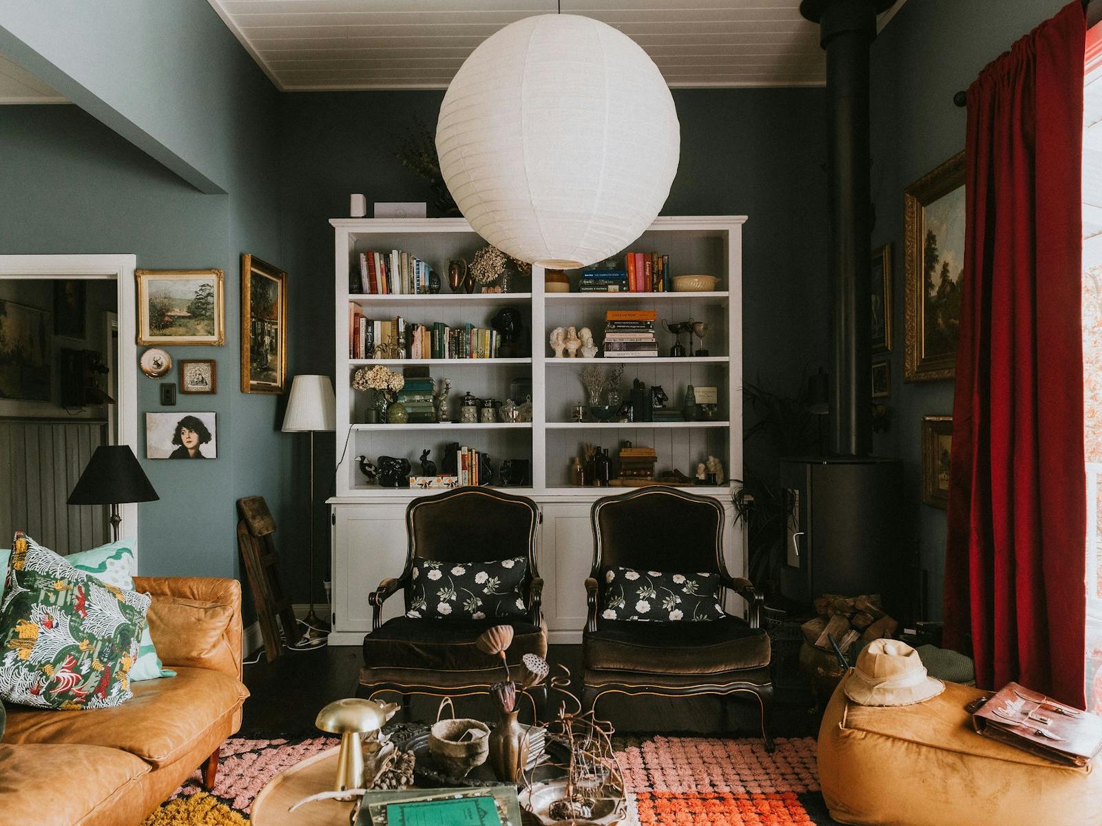 Lounge room that features bookcase and fire