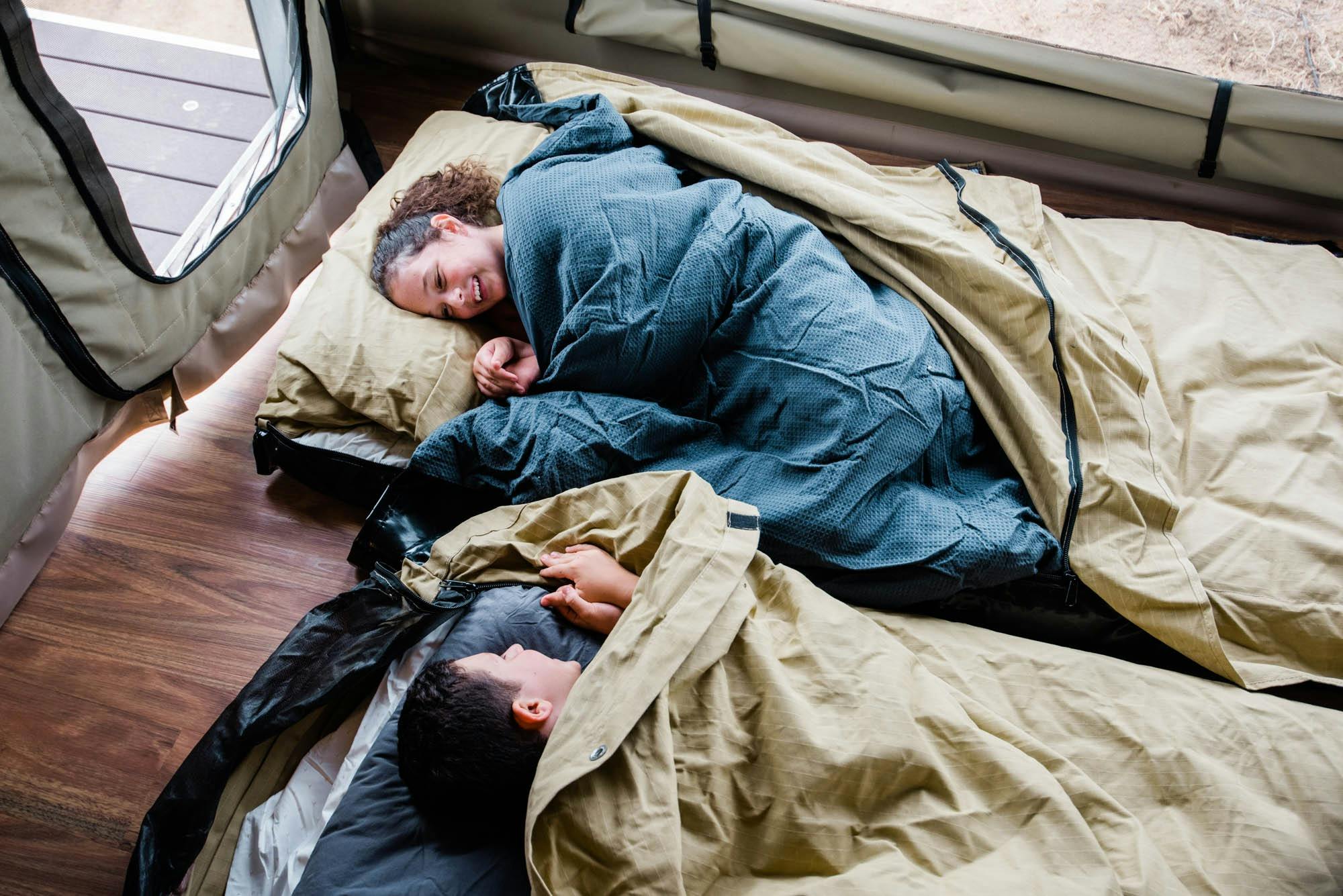 Happy children inside of swags