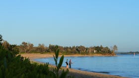 Sunrise reclaims the shadows at Whiting Beach.